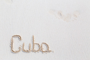  Inscription cube on the dense sand of the beach.Horizontally.Vertically.