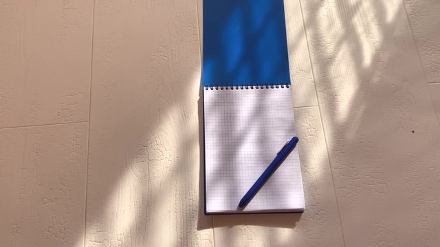 Scratchpad with pen on a white background