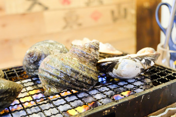 Grilled spotted babylon shell