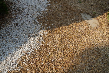 Brown and White pebble stone texture for background. The texture of brown gravel stones.