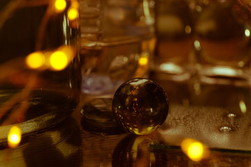 Christmas glass balls on the background color of whiskey