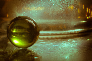 broun glass ball on blurred backgroung