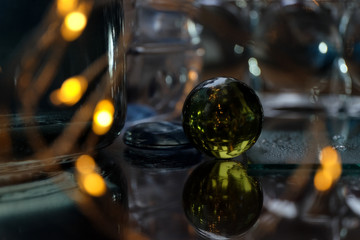 glass ball among the glare, reflections and lights