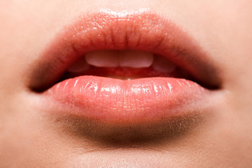 Fototapeta premium close up of woman with shiny lip gloss on lips