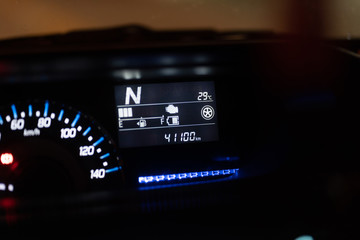 Modern car illuminated dashboard closeup