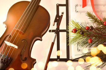 Christmas concert concept with violin and music stand and decoration