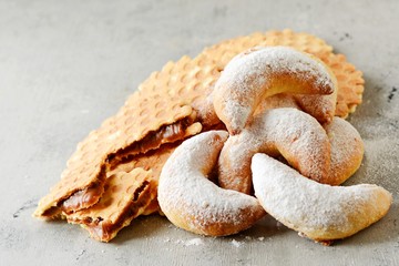  Christmas cookies on a Christmas background. Holiday atmosphere. Christmas background with Christmas cookies and sweets. Gift. Sweet waffle dessert. Belgian waffles.