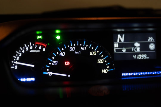 Modern car illuminated dashboard closeup