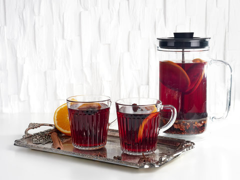Making mulled wine in a cafetiere or french press, on white background
