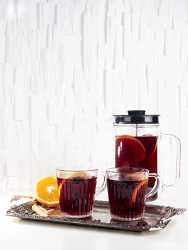 Making mulled wine in a cafetiere or french press, on white background
