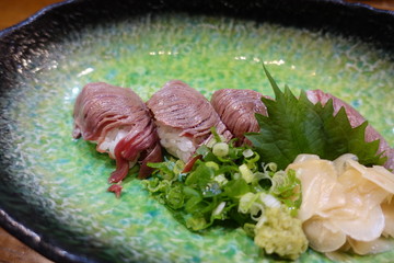 Dishes of Japanese traditional foods (Beef sushi)