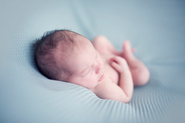 satisfied cute newborn baby sleeping