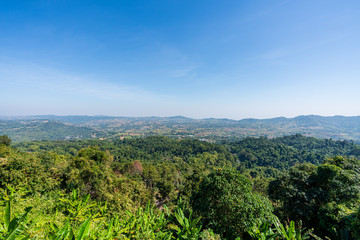 Obraz premium beautiful blue sky high peak mountains mist fog wildlife green forest at Khao Koh Phu Tub Berk Phetchabun Thailand guiding idea long weekend for backpacker camping campfire relaxing hiking 