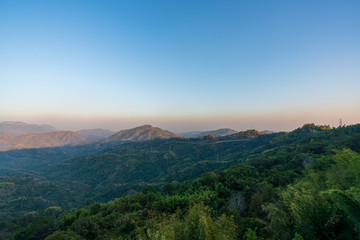 beautiful blue sky high peak mountains mist fog wildlife green forest at Khao Koh Phu Tub Berk Phetchabun Thailand guiding idea long weekend for backpacker camping campfire relaxing hiking  