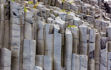 View on black Reynisfjara beach with impressive basalt columns in Southern Iceland in summer