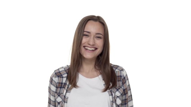Real emotions, relationship and happiness concept. Carefree, lively and friendly attractive girlfriend in plaid shirt, start smiling having fun, watching funny movie, hear joke, giggle from amusement