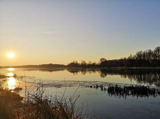 sunset over the  winter lake