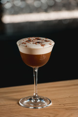 Espresso vodka cocktail on a bar desk.