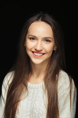 Portrait of beautiful happy girl with natural makeup and long straight hair