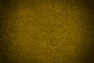 Fondo amarillo de una pared con manchas.