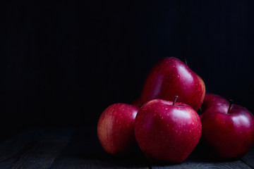 Fototapeta na wymiar Red Braeburn Apples on rustic wood surface.