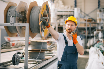 Factory worker with talkie walkie. 