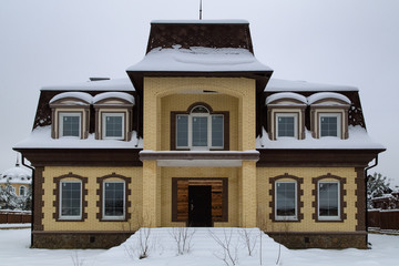 New cottage brick house after construction.  Modern architecture concept. Luxury house exterior details. 