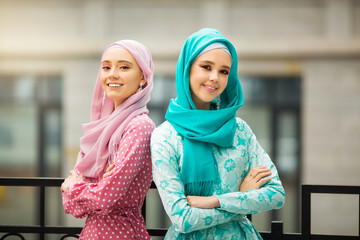 two beautiful young women in muslim dresses