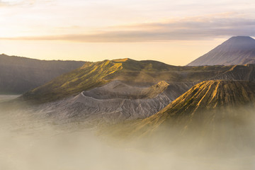 View from above, stunning close-up view of the Mount bromo crater and the Mount Batok surrounded by...