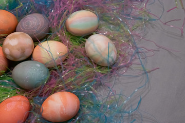 dyed easter eggs gathered together on a table