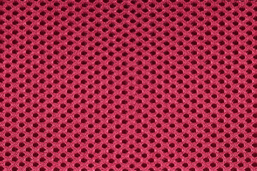 Close up of burgundy red mesh textile fabric