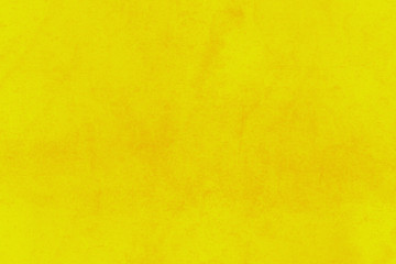 Fondo amarillo de una pared con manchas.