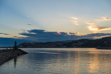 Clouds of contrasting color over the evening city