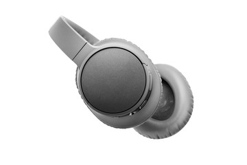 Gray wireless headphones on white background isolated close up, big grey bluetooth headset design, modern black wi-fi stereo sound earphones side view, high end audio music gadget, electronics device
