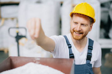 Factory worker. Man with helmet working.