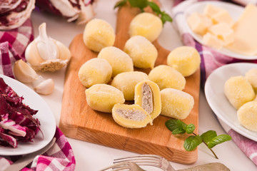 Potato gnocchi stuffed with radicchio and ricotta.