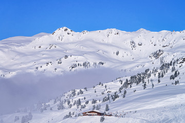 Fototapeta na wymiar Landscape at Zillertal Arena ski resort in clouds in Austria