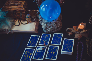 Tarot cards and crystal ball, candles, witch magic bottles . Wicca, esoteric, divination and occult...