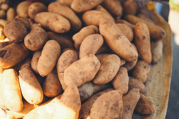 vegetables and potatoes are on sale in the fresh market