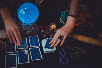 Tarot cards and crystal ball, candles, witch magic bottles . Wicca, esoteric, divination and occult...