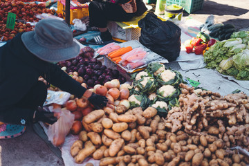vegetables and potatoes are on sale in the fresh market