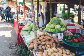vegetables and potatoes are on sale in the fresh market