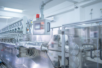 Machines for packing products Within the factory, sterile beauty industry in order to maintain maximum cleanliness.shallow focus effect.