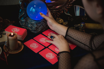 Tarot cards and crystal ball, candles, witch magic bottles . Wicca, esoteric, divination and occult...