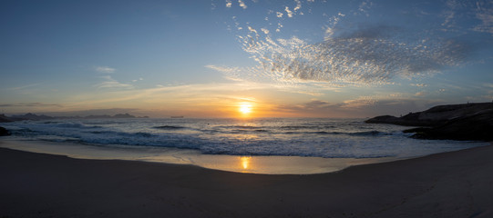 Super wide panorama of waves coming in at the Arpoador Devil's beach in Rio de Janeiro, Brazil, at...