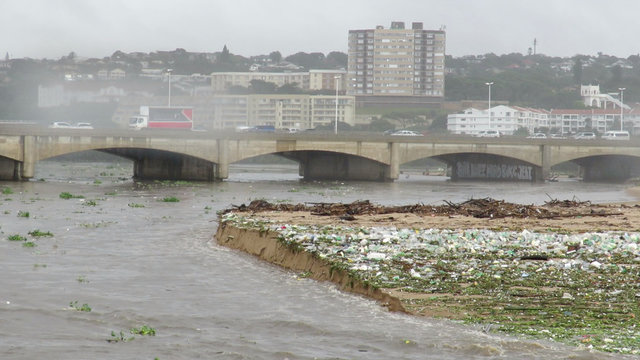 Still image of trash floating on a river in Durban