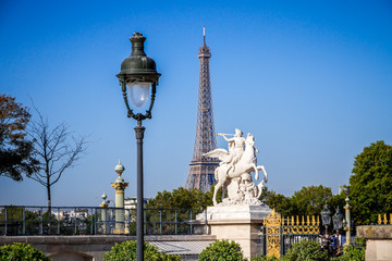 Fototapeta na wymiar Marble statue and Eiffel Tower view from the Tuileries Garden, Paris
