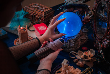 Tarot cards and crystal ball, candles, witch magic bottles . Wicca, esoteric, divination and occult...