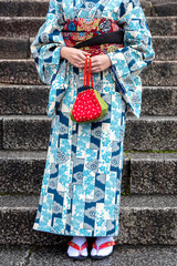 Detail of a japanese woman dressed in traditional costume