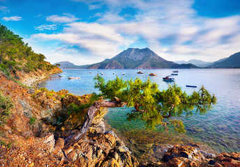 Obraz premium Splendid summer seascape of Mediterranean sea. Sunny morning view of Adrasan bay with view of Moses Mountain, Turkey, Asia. Beauty of nature concept background..